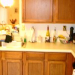 1 Plastic oak cabinets before