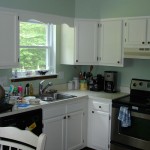 14 Oak Cabinets after painted off white.